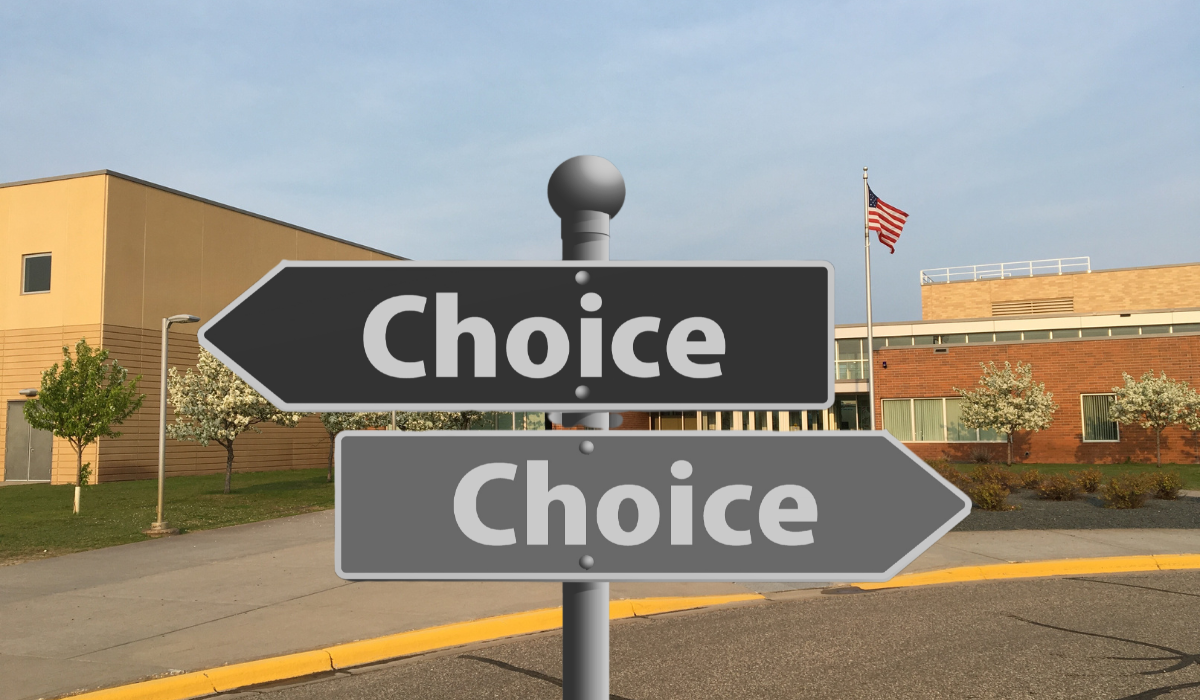 photo of a school with a two signs saying CHOICE and pointing in opposite directions