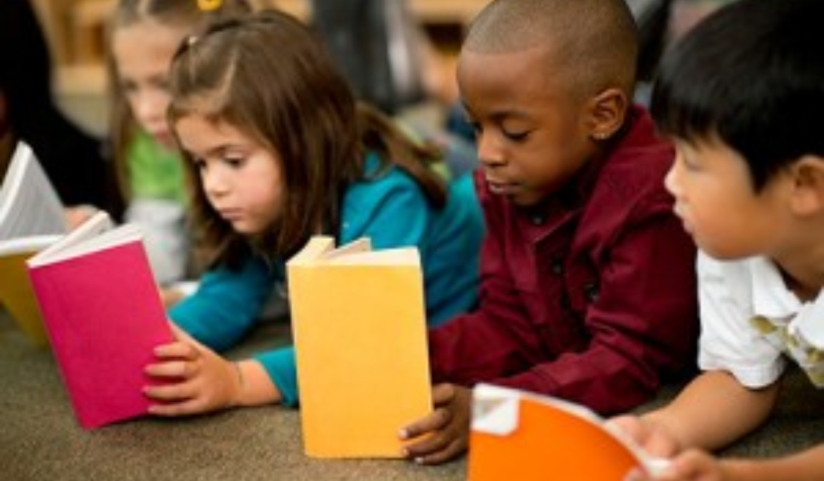 second graders reading from colorful books