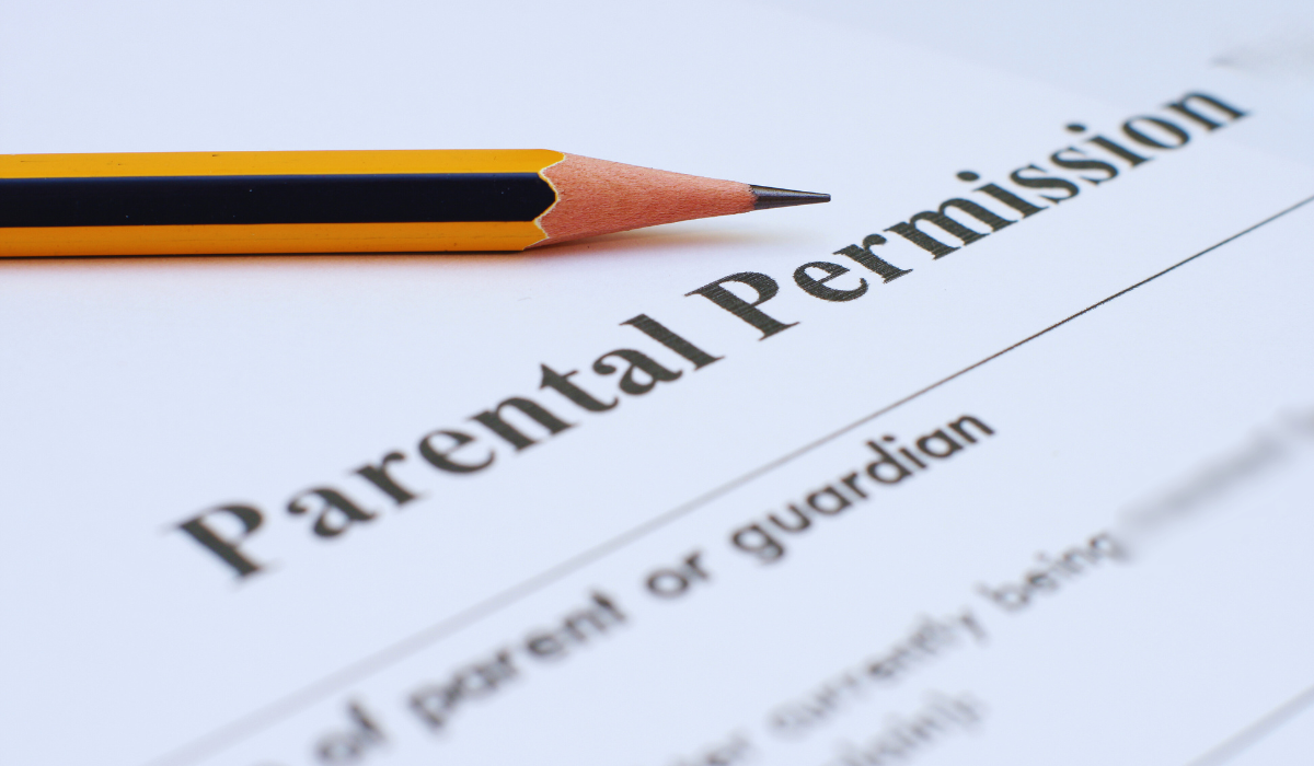 photo of a paper with the words PARENTAL PERMISSION next to a pencil