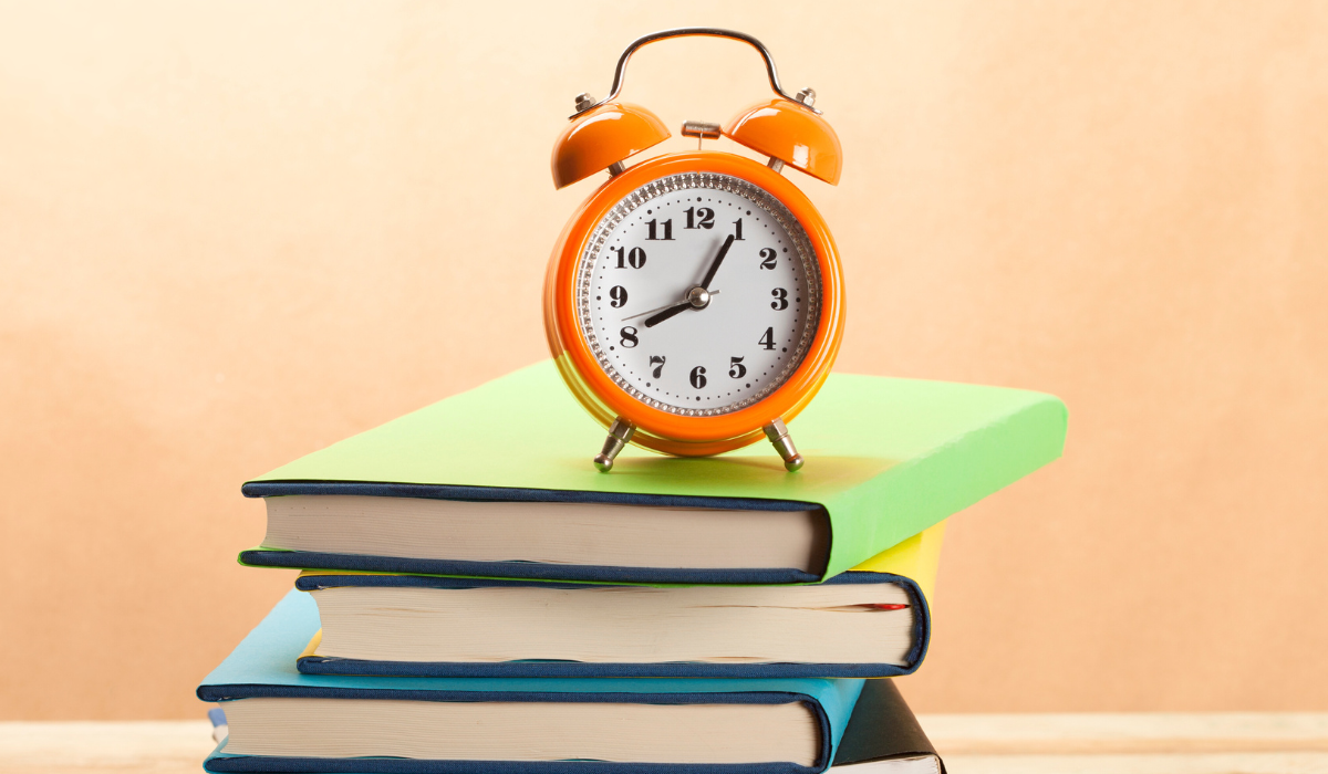 clock on a stack of books